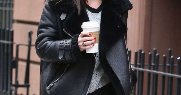 Dakota Johnson in black fur collar coat with brown Louis Vuitton